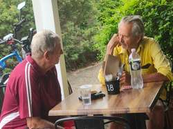 The other two a distance away. Did Jeff order a second coffee?