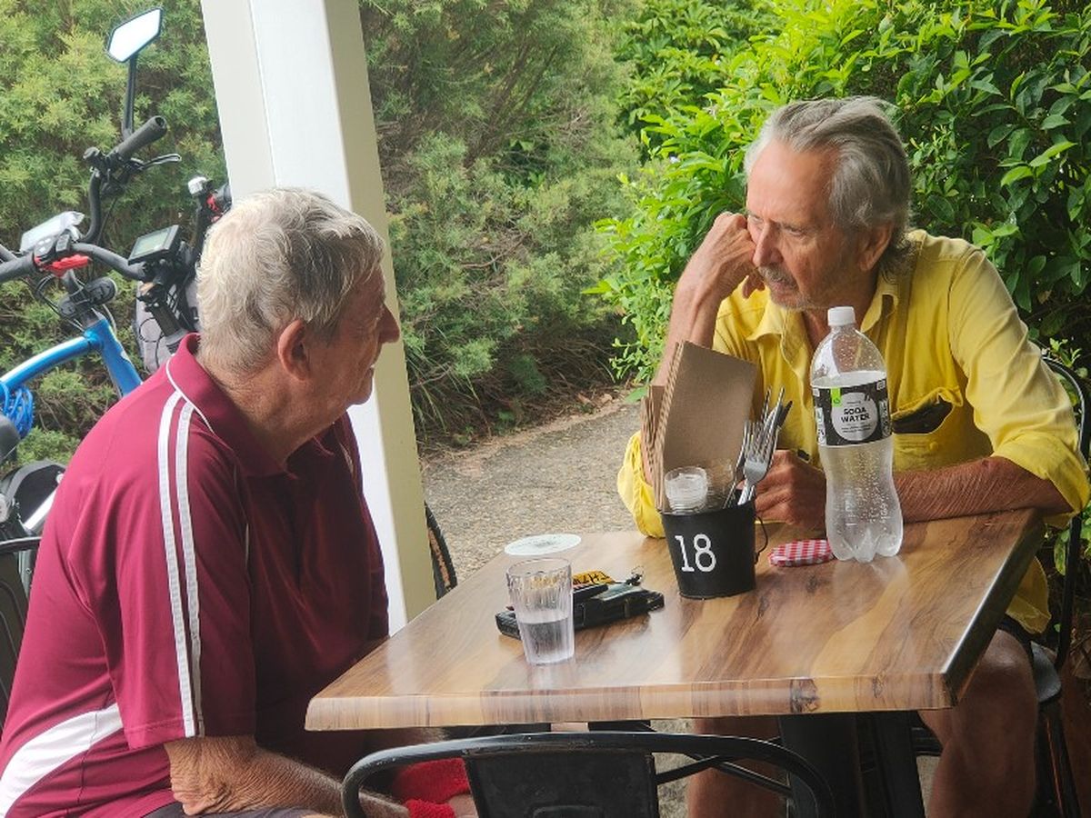 The other two a distance away. Did Jeff order a second coffee?